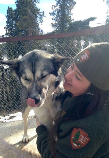 Chandler in NPS uniform with dog