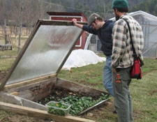 SD students looking at plants in cold frame